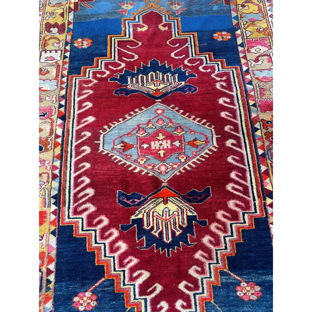 Vibrant antique Turkish Melas rug with red blue geometric tribal patterns