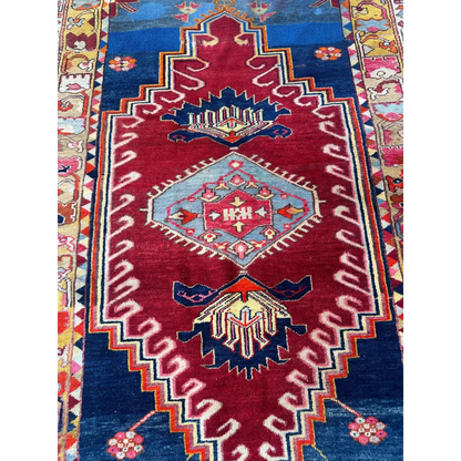 Vibrant antique Turkish Melas rug with red blue geometric tribal patterns
