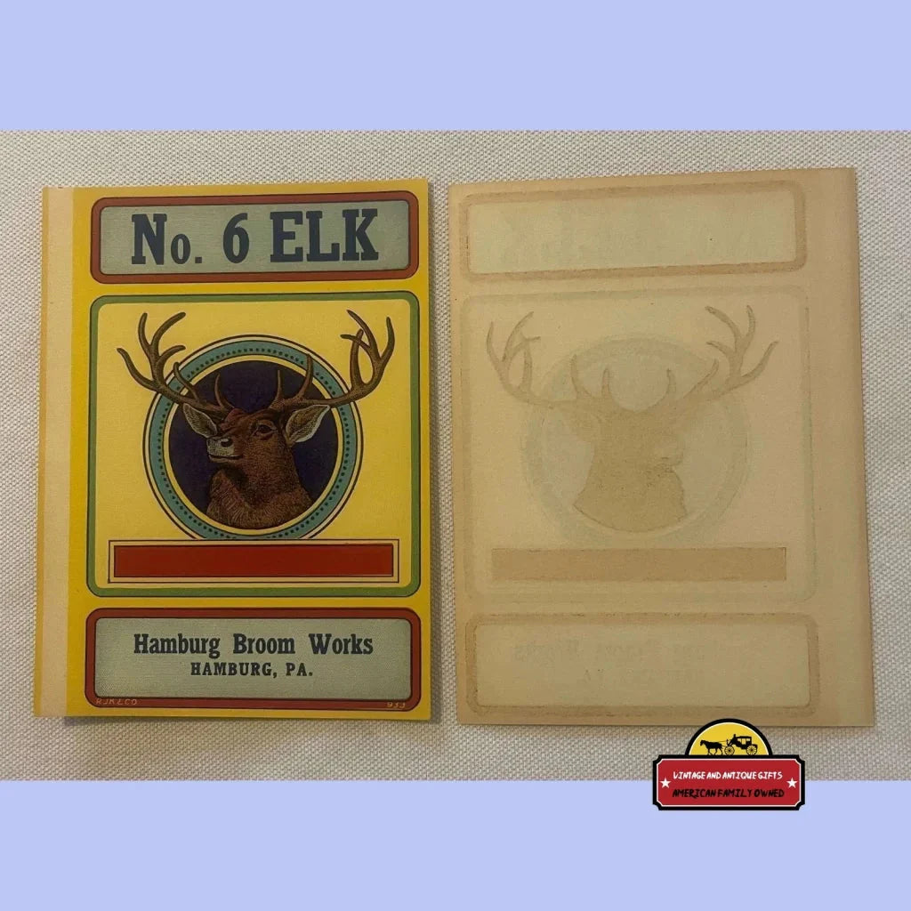 Vintage elk broom label showcasing an elk design with stamp beside it