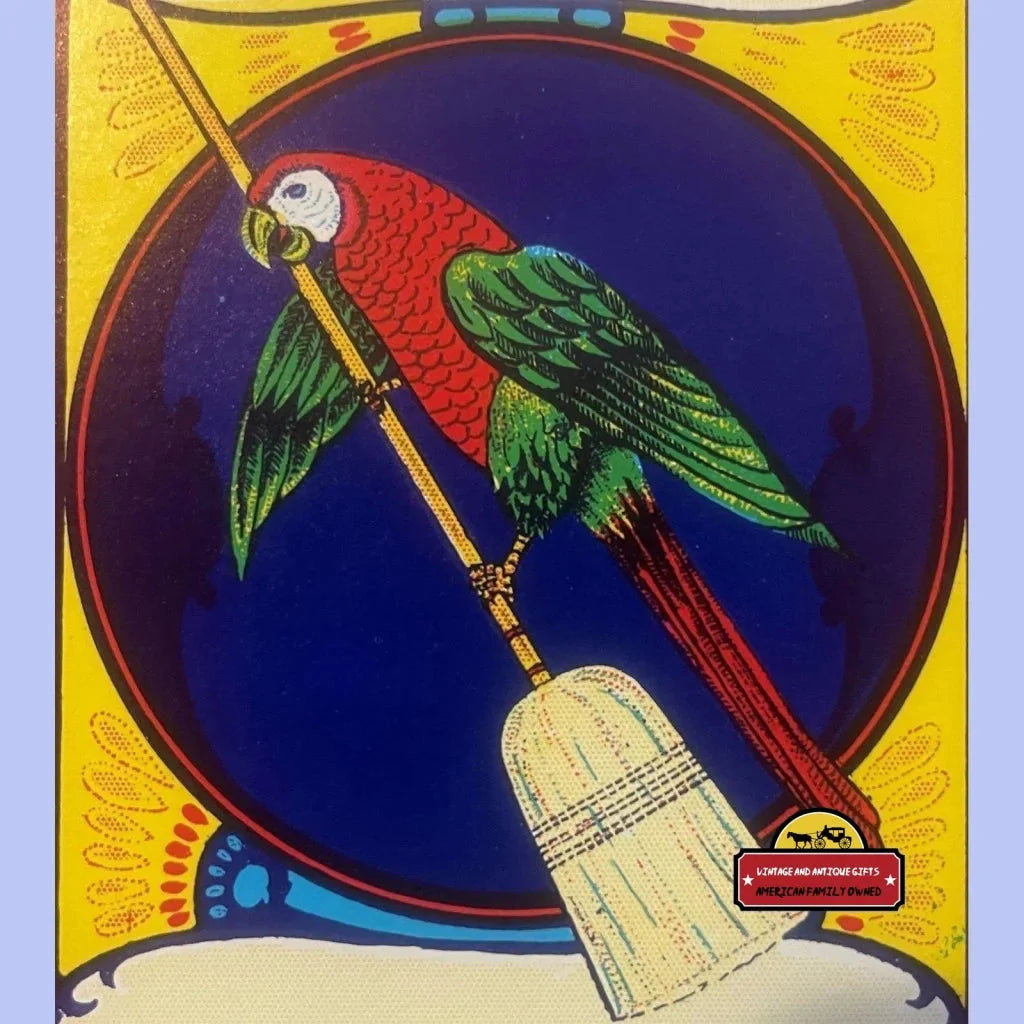 Colorful parrot perched on a broom handle for the Parrot Broom Label with 1920s charm