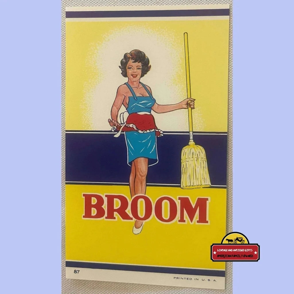 Vintage 1910s broom label featuring a woman in a blue dress with a broom