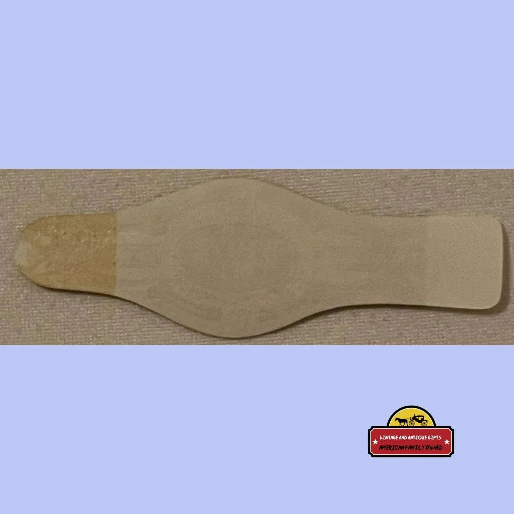 Beige wooden paddle, perfect for showcasing an Antique Vintage White Tip Cigar Band