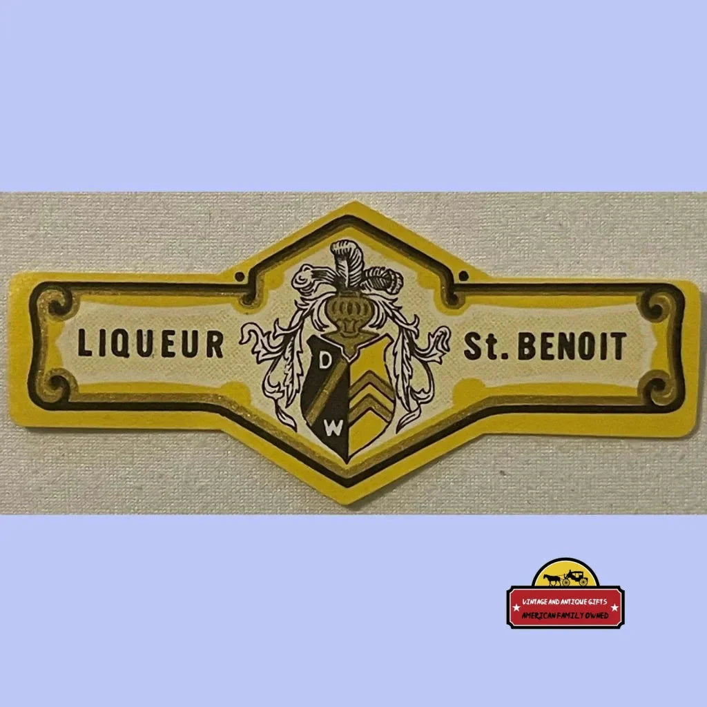 Vintage yellow and black St Benoit liqueur neck label with heraldic design from 1920s France