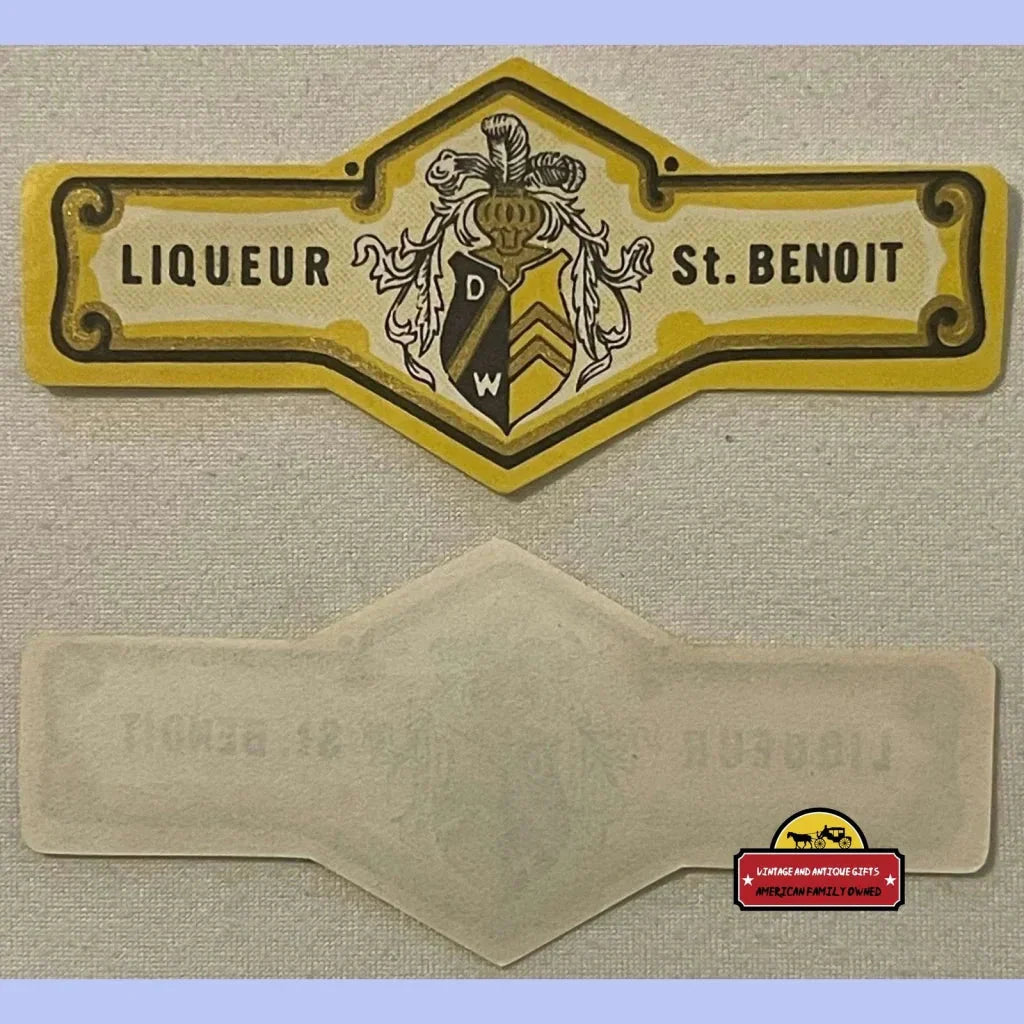 Vintage yellow and black Liqueur St. Benoit neck label with heraldic crest design