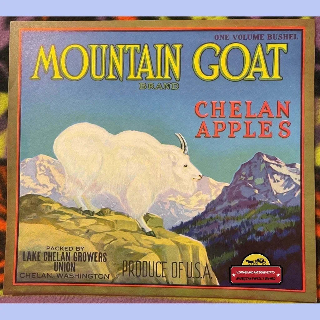 Vintage crate label showcasing a mountain goat and snowy peaks for Chelan apples