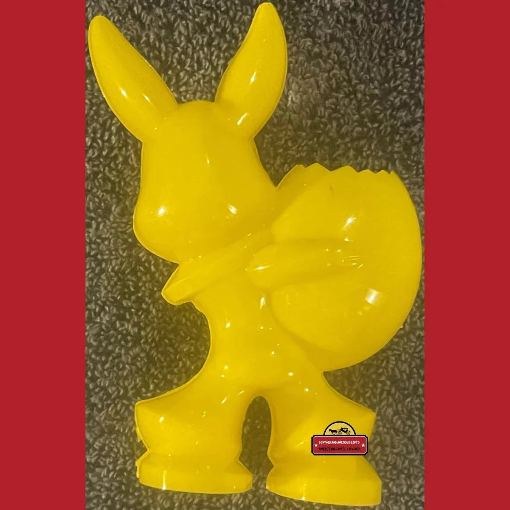 Bright yellow cartoon rabbit candy holder perfect for adding Easter cheer to your decor