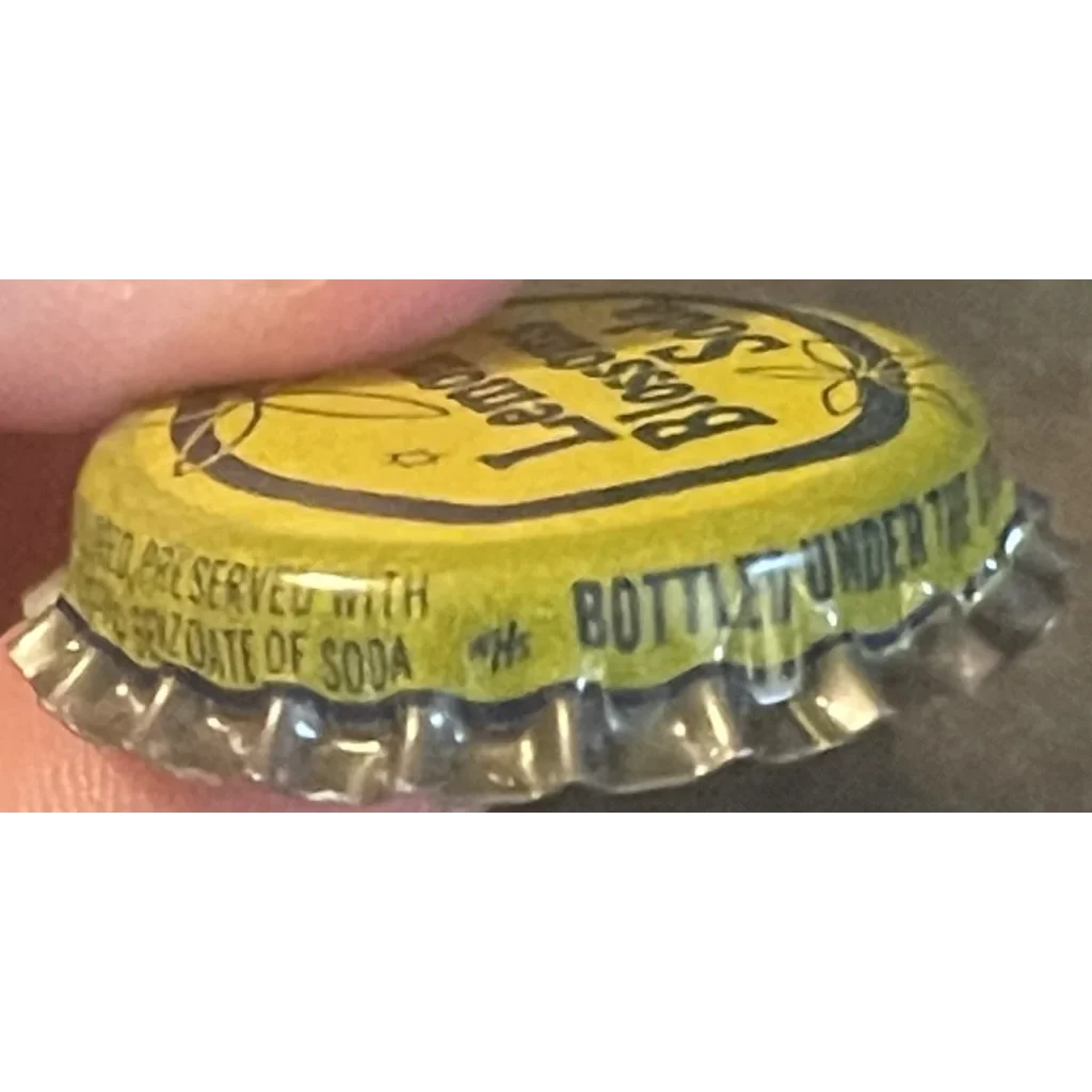 Yellow cork bottle cap with a smiley face from Antique Vintage 1950s Lemon Blossom Soda