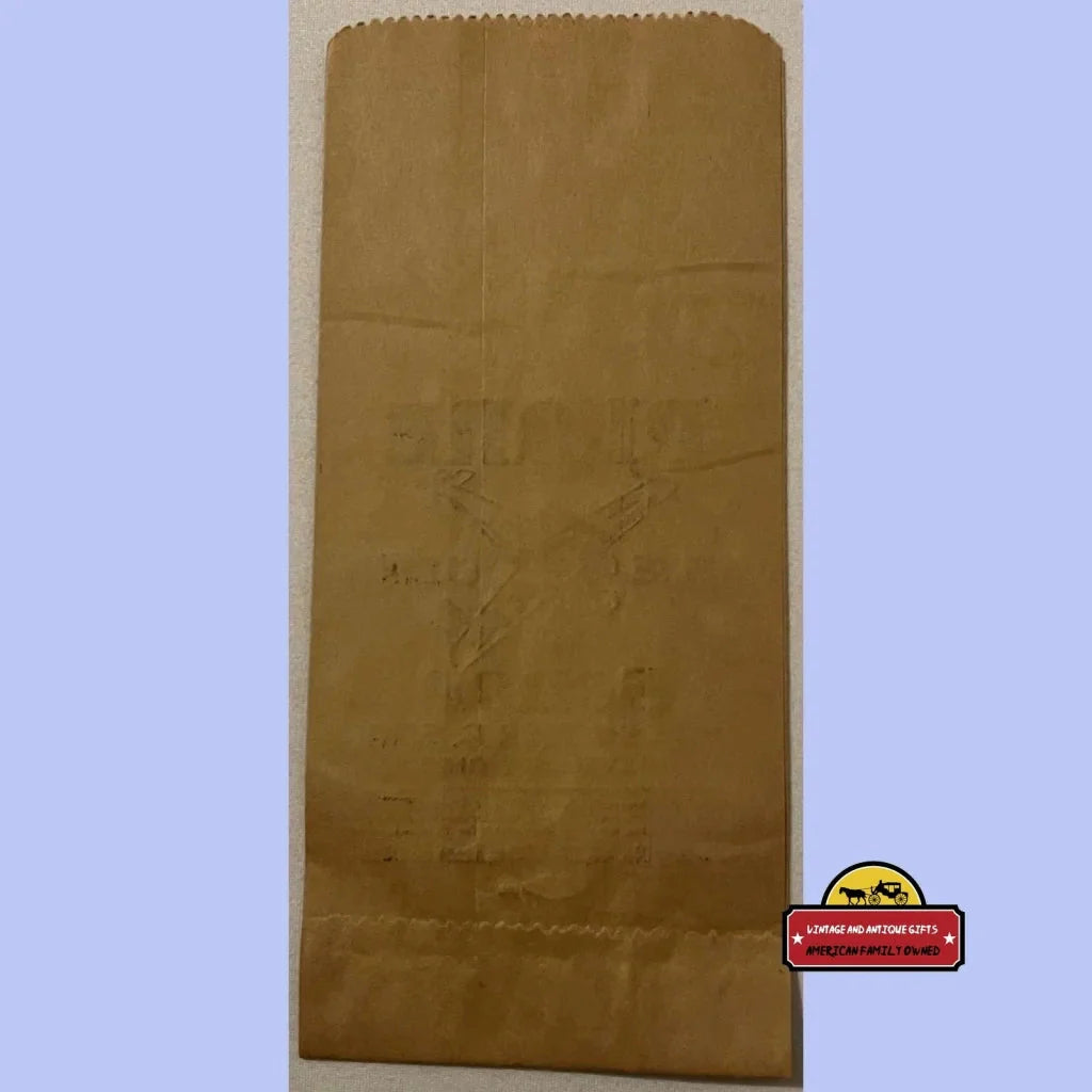 Brown paper bag with serrated top edge for a Rare Antique Vintage Plane Cigar