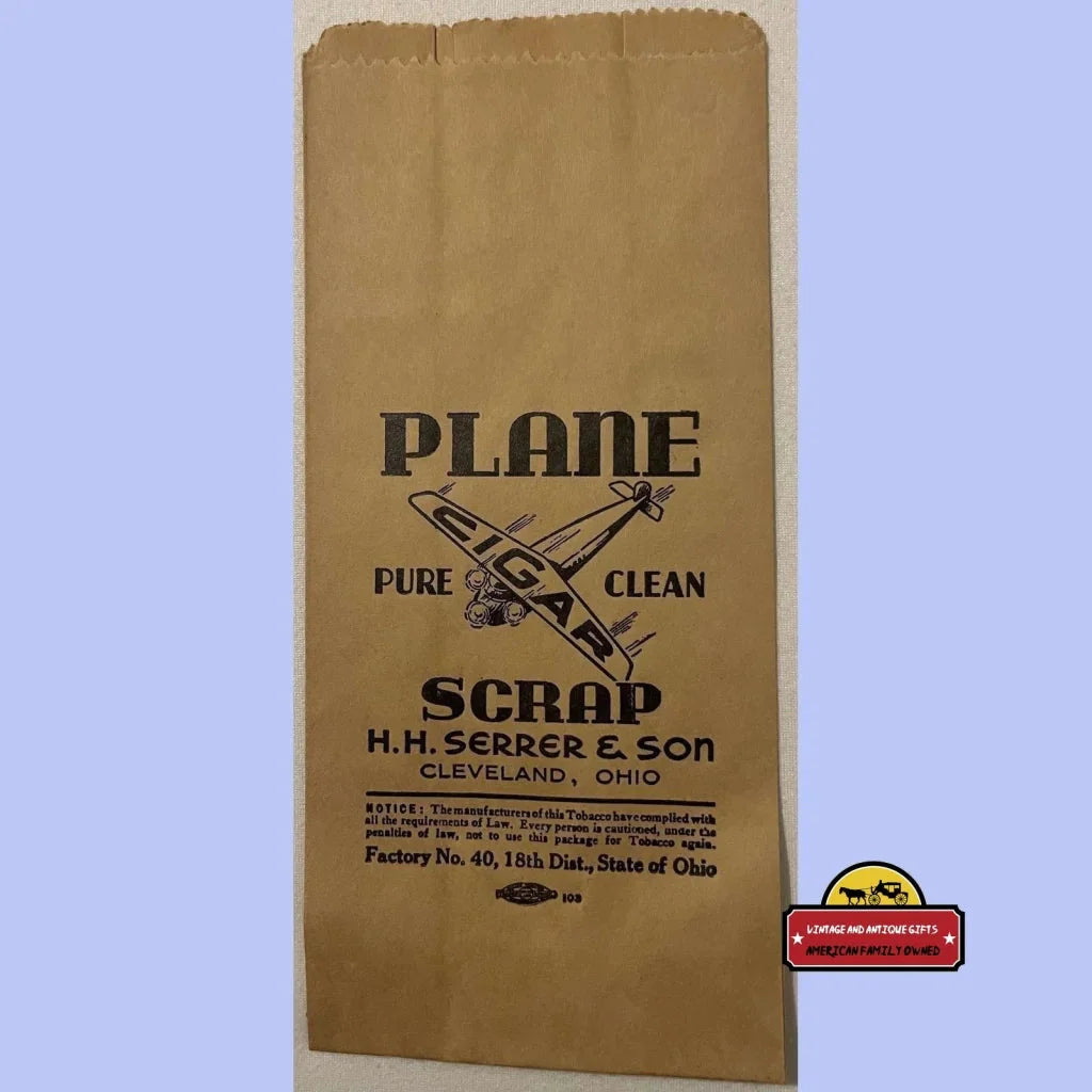 Brown paper bag with PLANE SCRAP and airplane logo, perfect for vintage plane cigar fans