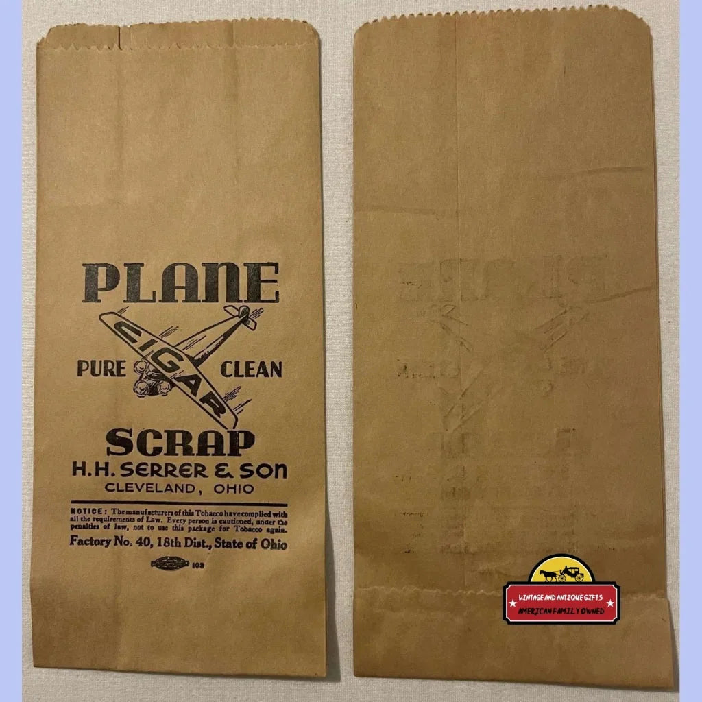 Two brown paper bags featuring the Plane Scrap logo, perfect for antique vintage collectors