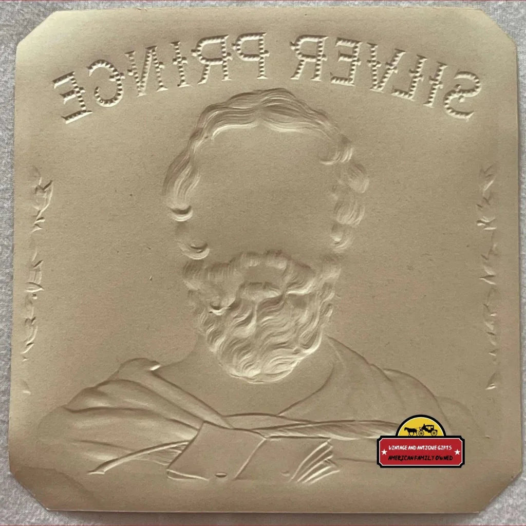 Embossed plaster relief of a bearded man’s bust above SUPER DRINKS, Silver Prince cigar label