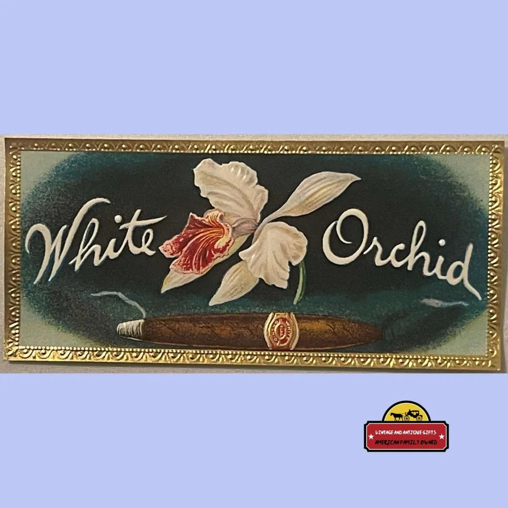 Vintage advertisement sign for White Orchid featuring a painted orchid flower