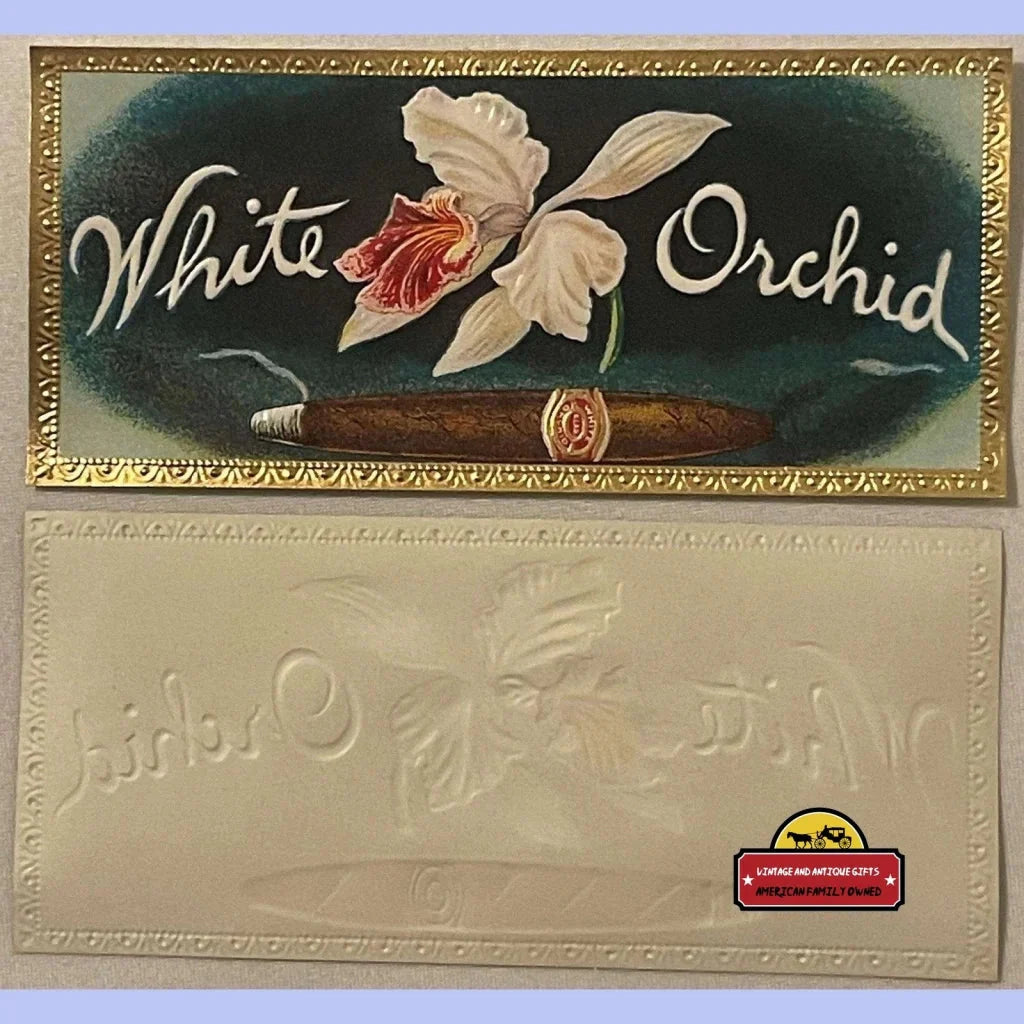 Vintage cigar box lid with White Orchid text and an illustrated orchid flower design