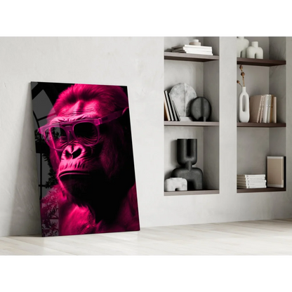 Bold red gorilla glass wall art with sunglasses portrait on canvas leaning against white wall