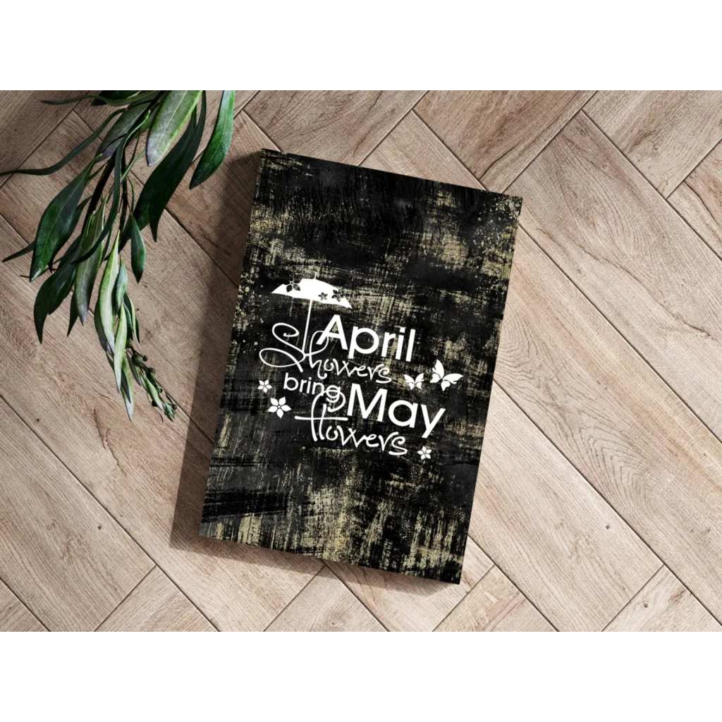 Black distressed wood plaque with April Showers Bring May Flowers text and butterflies