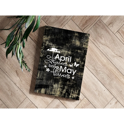 Black distressed wood plaque with April Showers Bring May Flowers text and butterflies