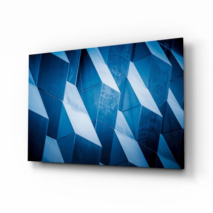 Stunning blue geometric glass wall art with sharp angular shapes