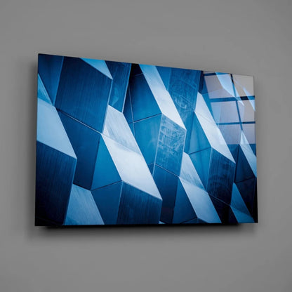 Stunning blue geometric glass wall art with sharp angular shapes
