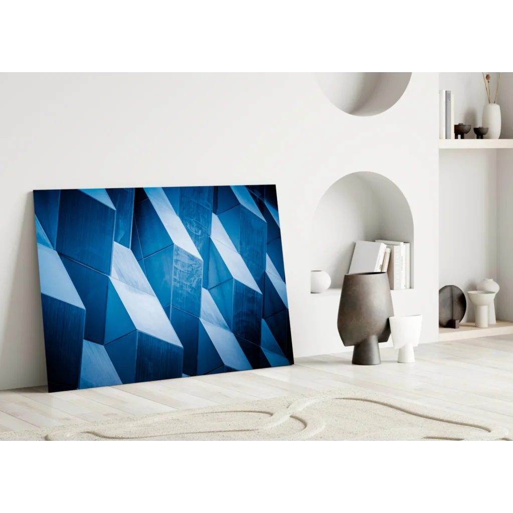 Stunning blue geometric glass wall art leaning on white wall