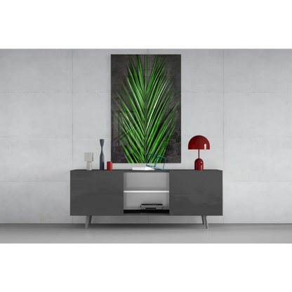 Vibrant green palm leaf glass wall art on dark gray textured canvas
