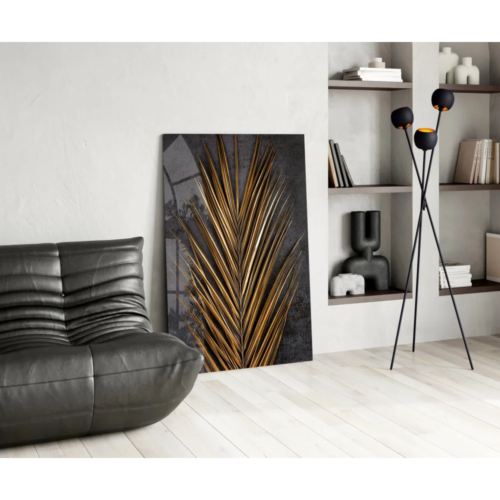 Gold palm leaf glass wall art on dark textured background