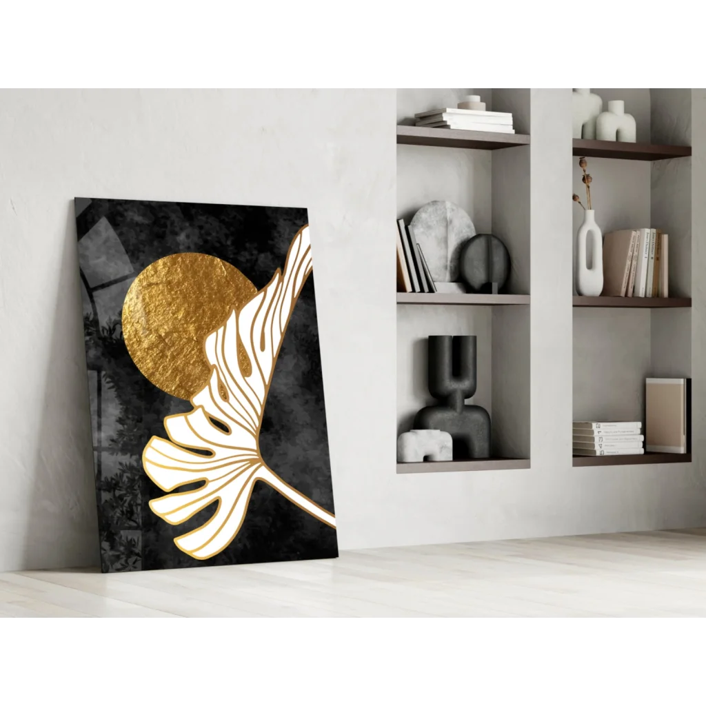 Stylized white monstera leaf wall art on black canvas with gold circle