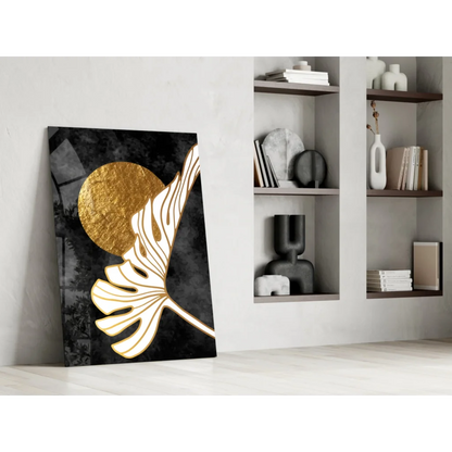 Stylized white monstera leaf wall art on black canvas with gold circle