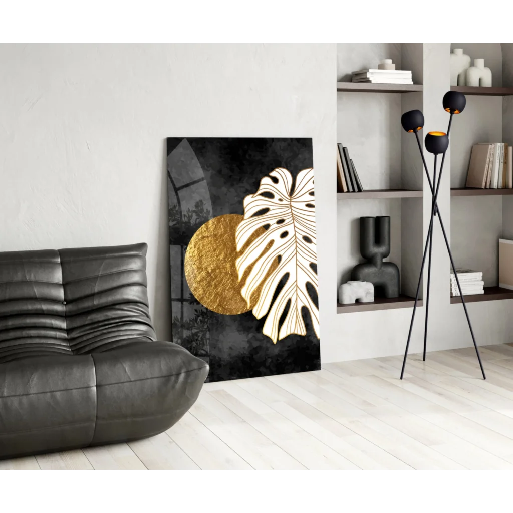 Black and gold monstera leaf wall art with textured circle