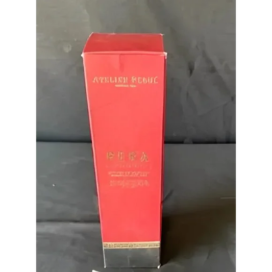 Red rectangular perfume box with gold accents for Atelier Rebul Pera diffuser sticks fragrance