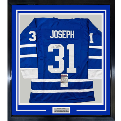 Framed blue Toronto Maple Leafs jersey number 31 with "Joseph" nameplate and signature, displayed front-facing in black frame with white matting and JSA authenticity certificate.