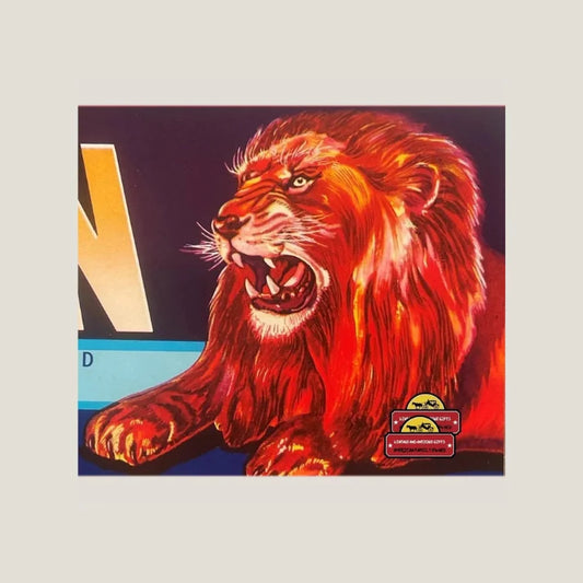 Vintage red illustrated roaring lion on dark background with partial letter visible.