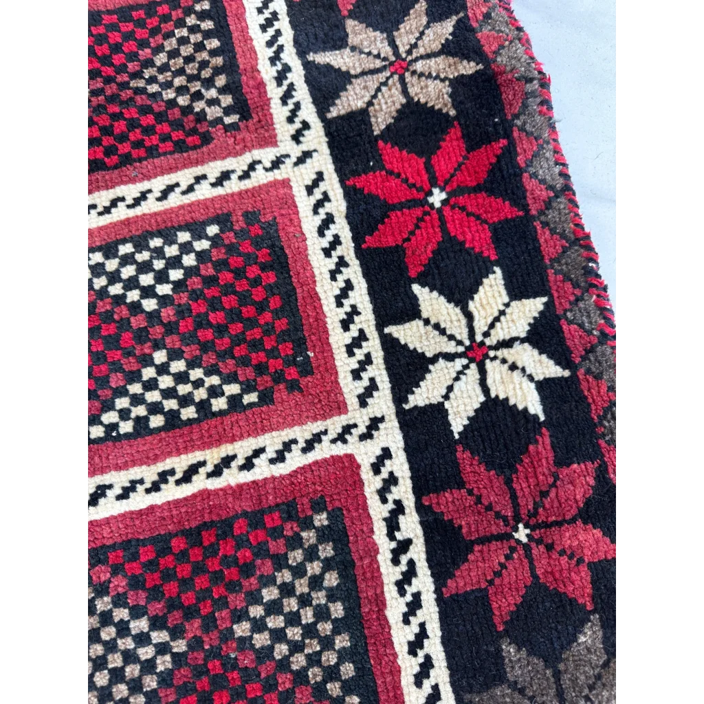 Vintage 1980s Persian Lori nomadic carpets with bold red geometric floral patterns