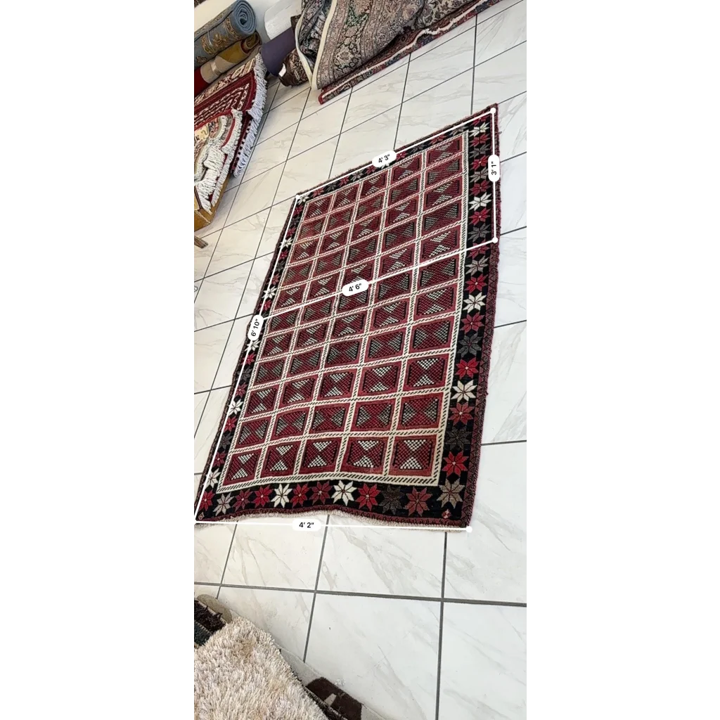 Rich burgundy black 1980s Persian Lori nomadic carpets with floral borders