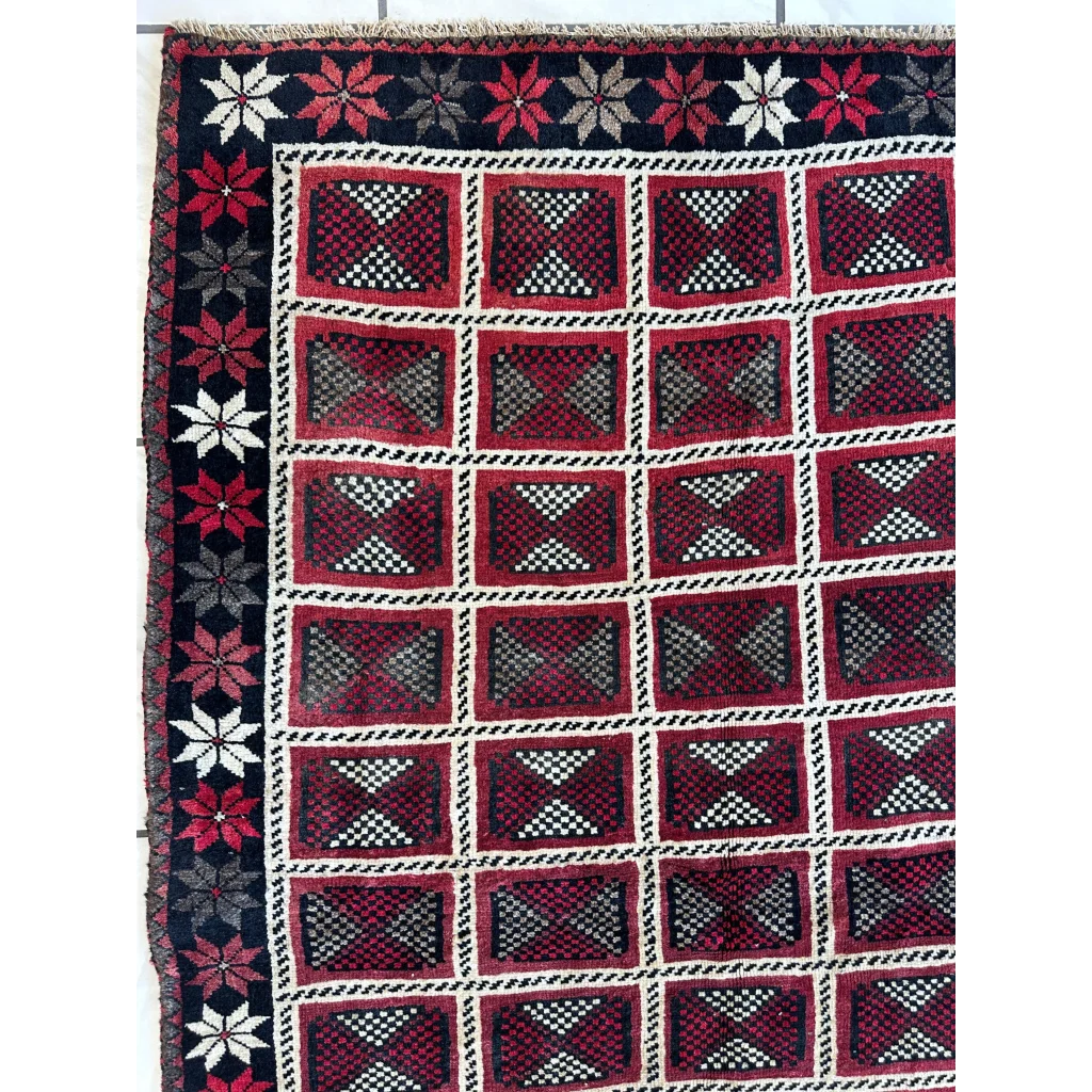 1980s Persian Lori nomadic carpets with red geometric patterns and floral borders