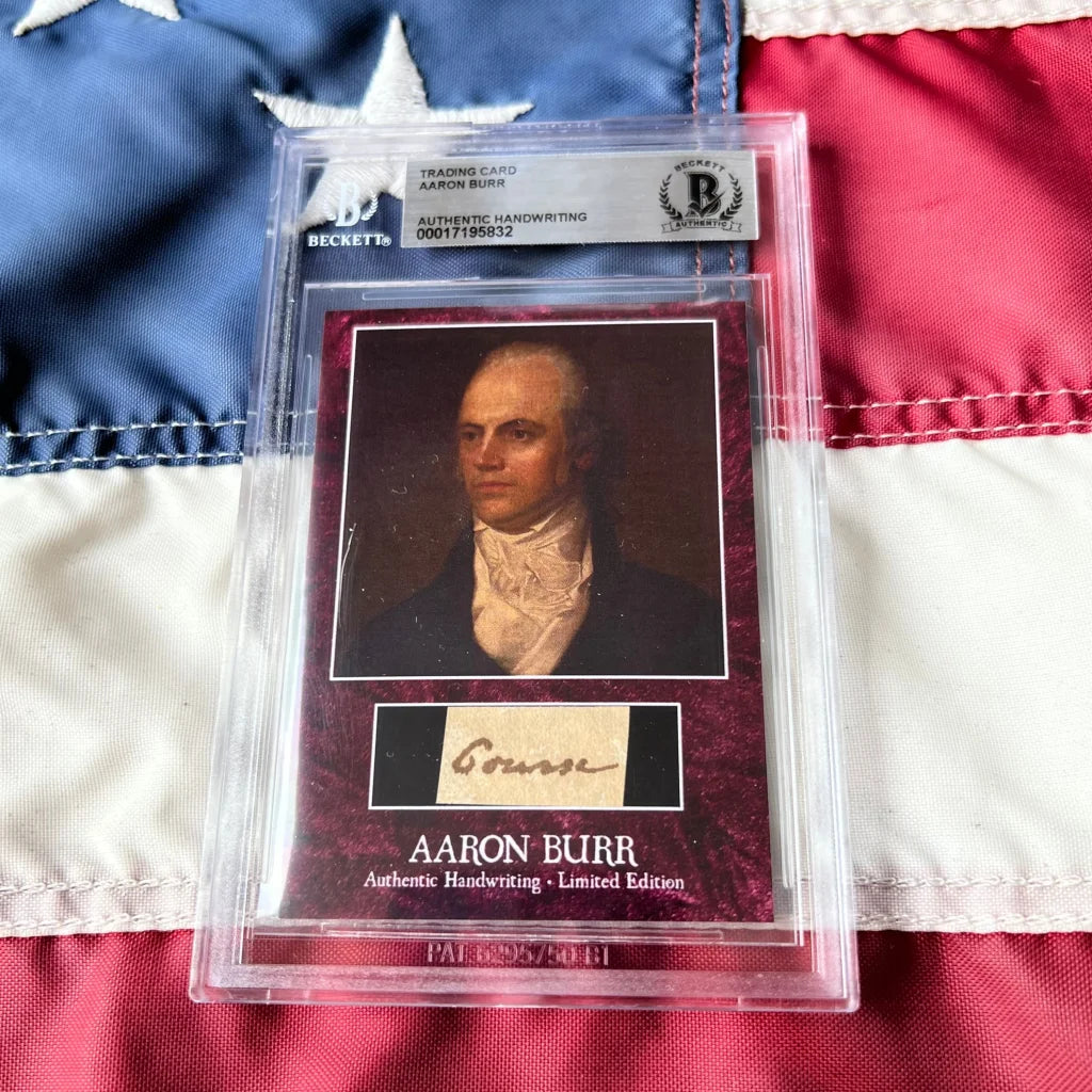 A framed authentic Aaron Burr trading card with portrait and authentic handwriting in a Beckett certified slab