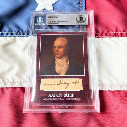 A maroon textured trading card featuring a portrait of aaron burr with authentic handwriting in burr words graded set