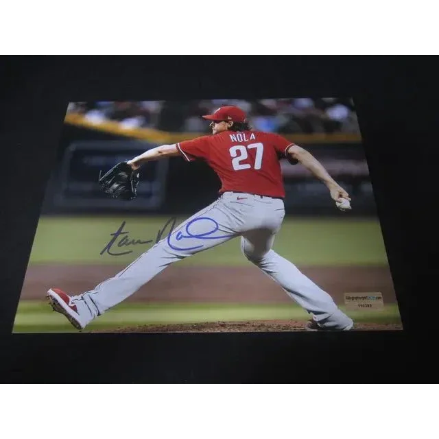 Autographed Aaron Nola 8x10 photo of a Phillies pitcher in a red jersey