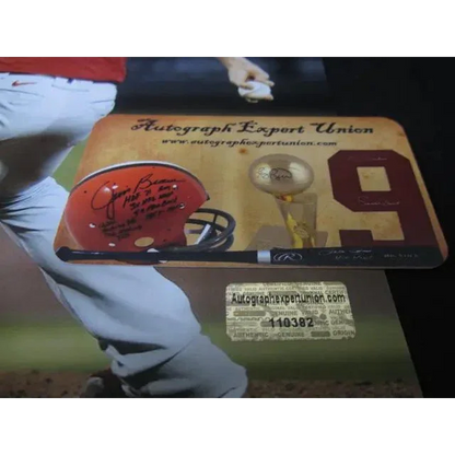 Autographed football helmet, bat, trophy with 8x10 photo of Aaron Nola on display