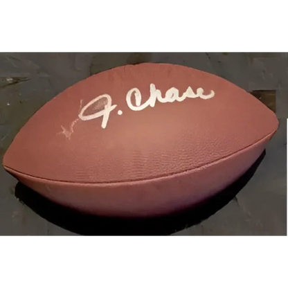 Autographed brown football with official certificate for authentic collectible fun