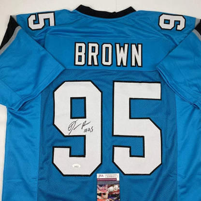 Light blue custom jersey with BROWN 95 signed by a pro sports athlete with JSA sticker