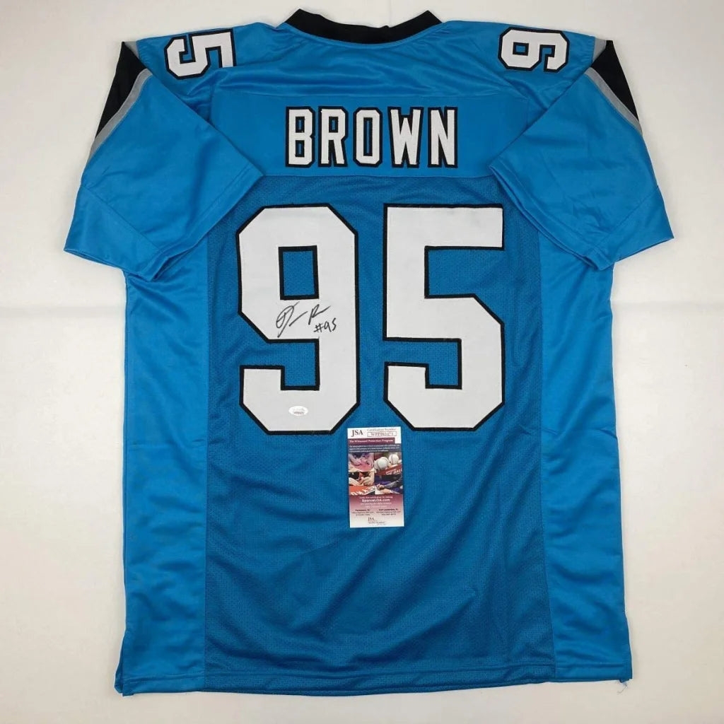 Carolina Panthers #95 blue custom jersey signed by BROWN from professional sports league