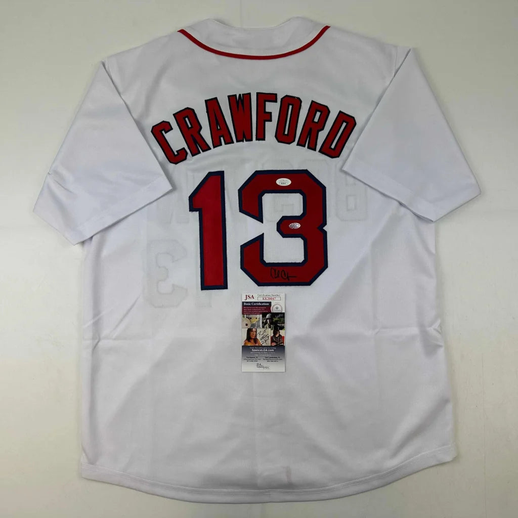 White custom jersey with red trim and numbers from professional sports league memorabilia