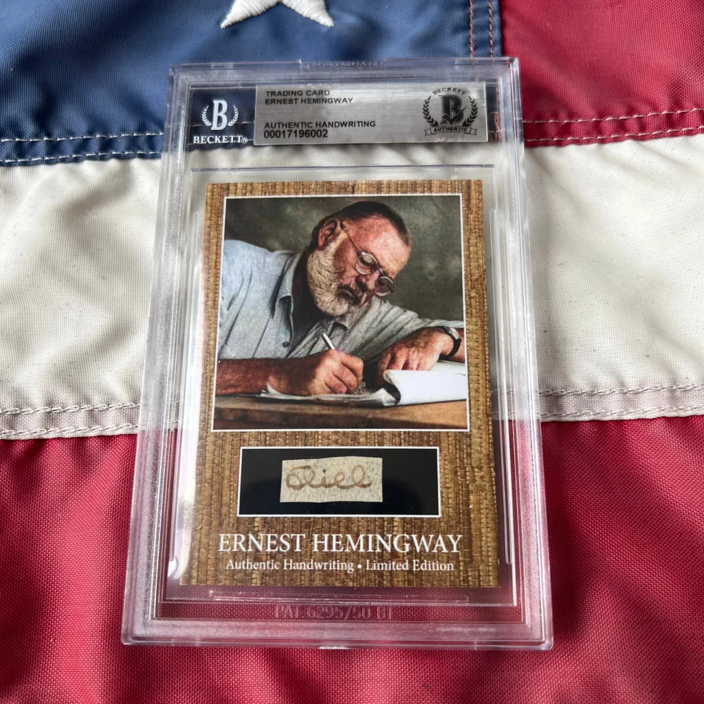 Authentic ernest hemingway handwritten signature trading card with portrait in beckett graded slab on textured brown backing