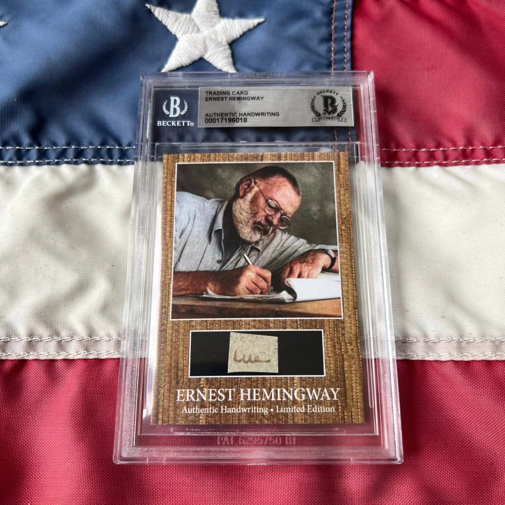 Authentic ernest hemingway handwriting trading card encased in clear protective slab with textured brown background and black panel