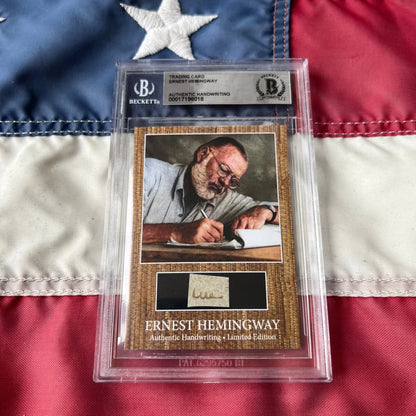 Authentic ernest hemingway handwriting trading card encased in clear protective slab with textured brown background and black panel