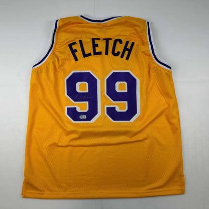 Yellow basketball jersey with purple and white numbers from Authentic FLETCH 99 custom jersey collection for professional sports fans