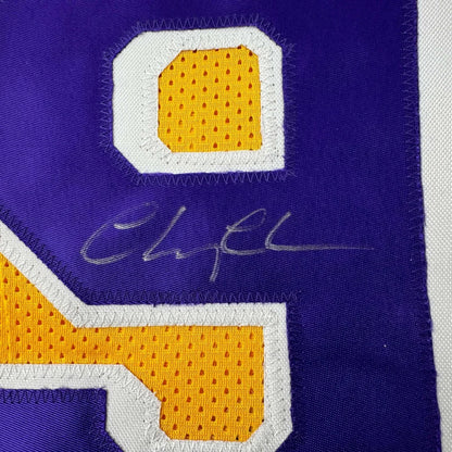 Purple and yellow custom basketball jersey with signature from professional sports league