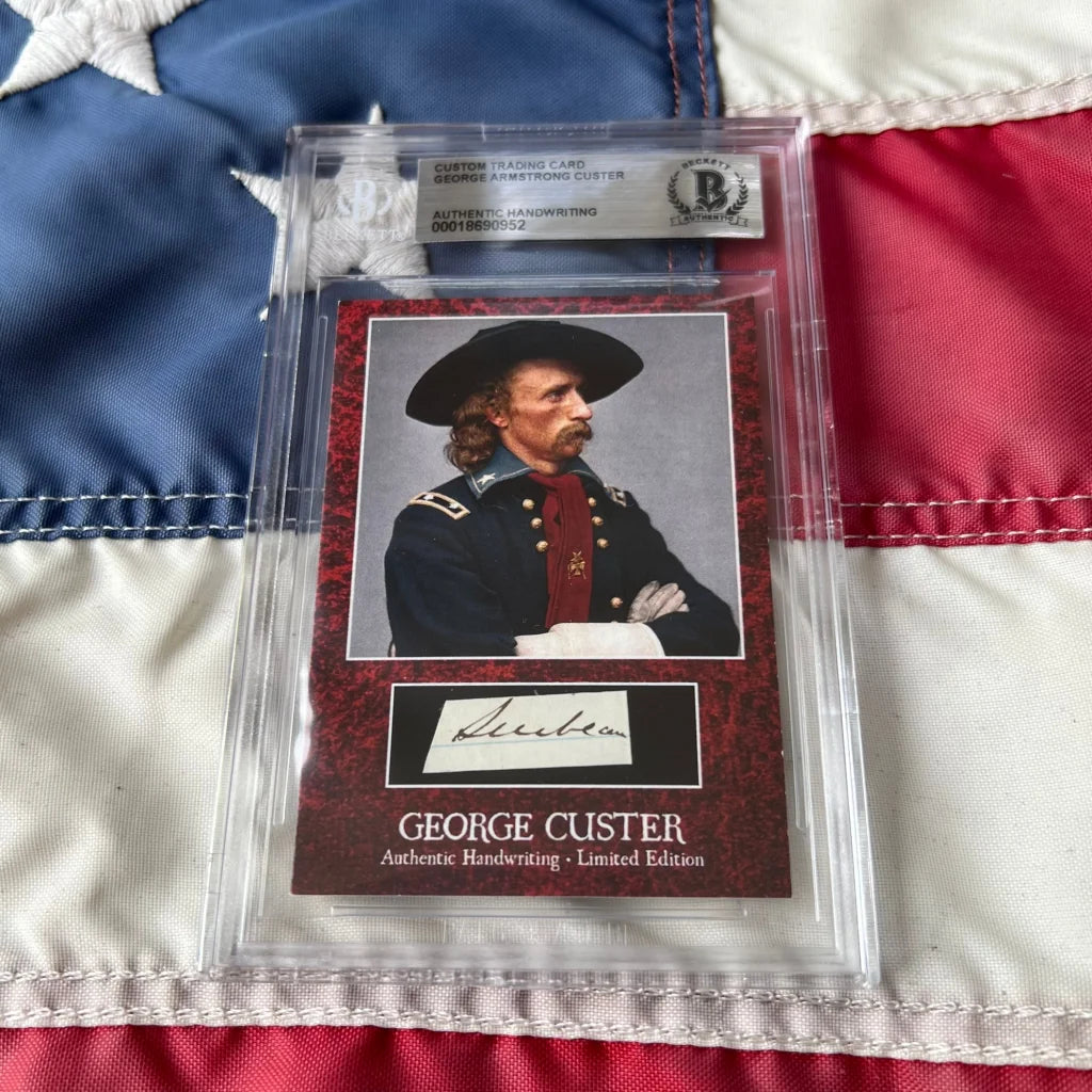 A framed authentic george custer words graded card with portrait in military uniform and handwritten signature on black background