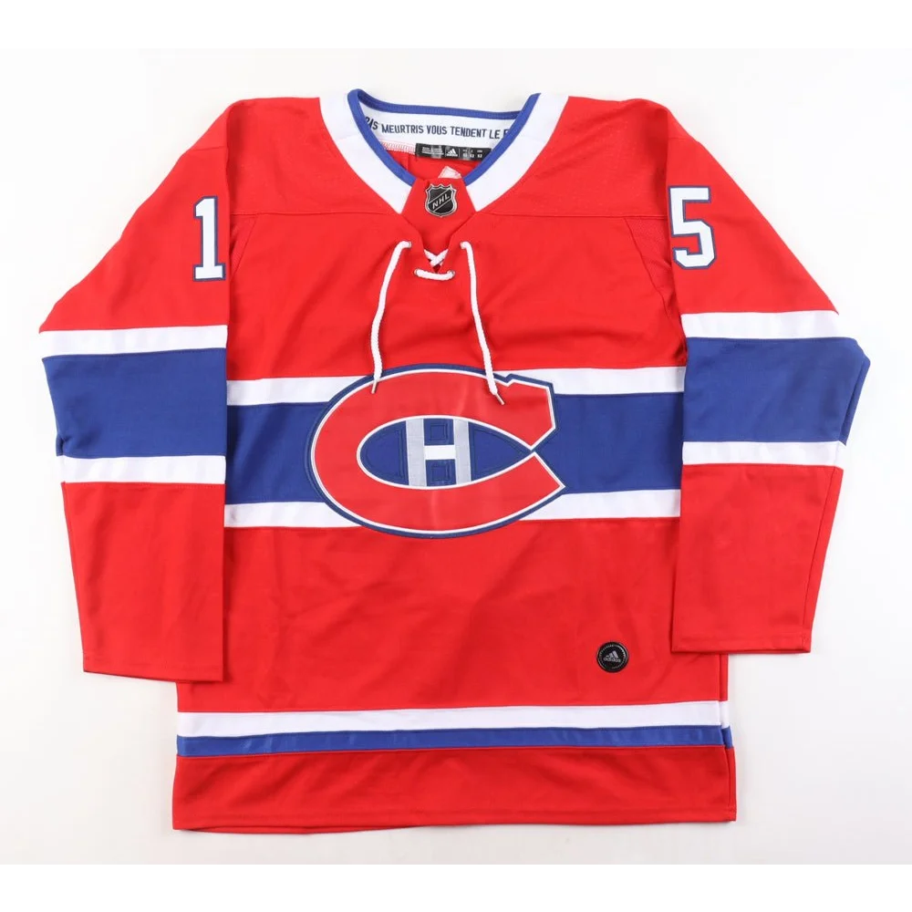 Red Montreal Canadiens jersey with blue and white stripes and Jesperi Kotkaniemi number 15