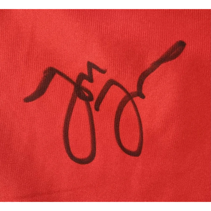 Black handwritten signature on red MMA trunks signed by Jon Jones with Beckett Auth